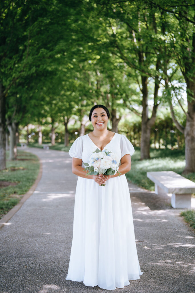 Full length bridal portrait with bride holding her bouquet