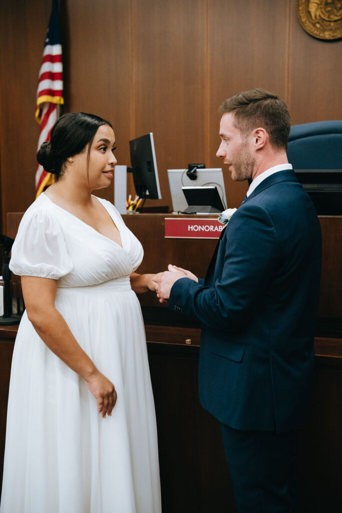 Bride and groom exchanging vows in Clayton County Courthouse