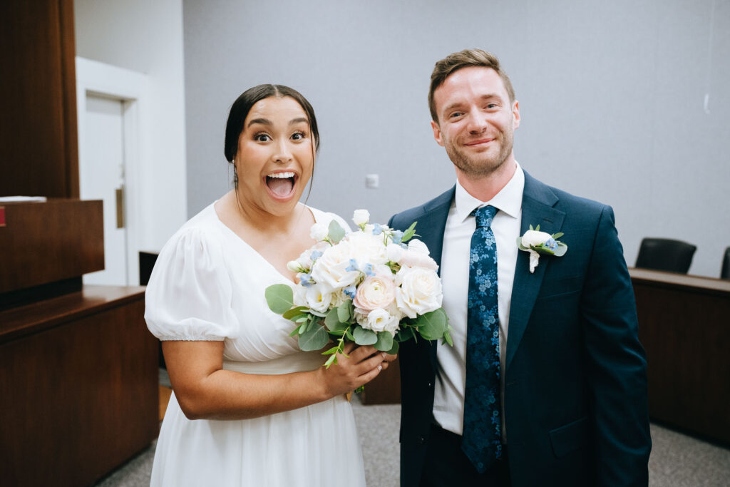 Bride and groom smiling after getting married at Clayton Courthouse