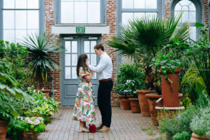 Couple embracing at the mobot garden